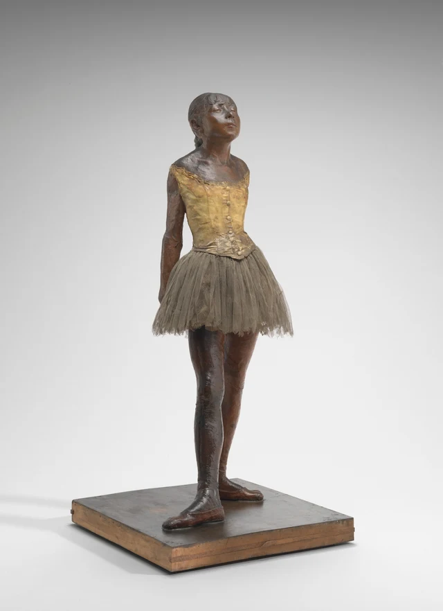 Full-length view of the same wax sculpture from a slightly oblique frontal angle. Compared with Figure 1, the legs overlap more closely in the image, and more of the arms are concealed behind the body.